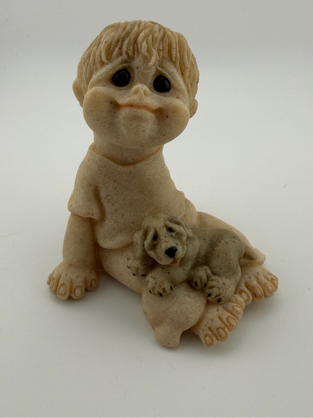 Beige Resin Boy Figurine with Puppy